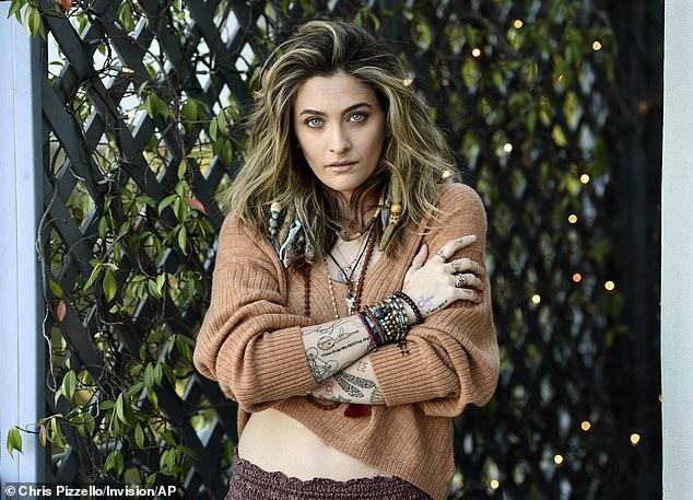 Boho babe: Paris Jackson wore beads in her hair, harem trousers, and a midriff-baring crop top in a photo shoot promoting her new music in Beverly Hills on Tuesday